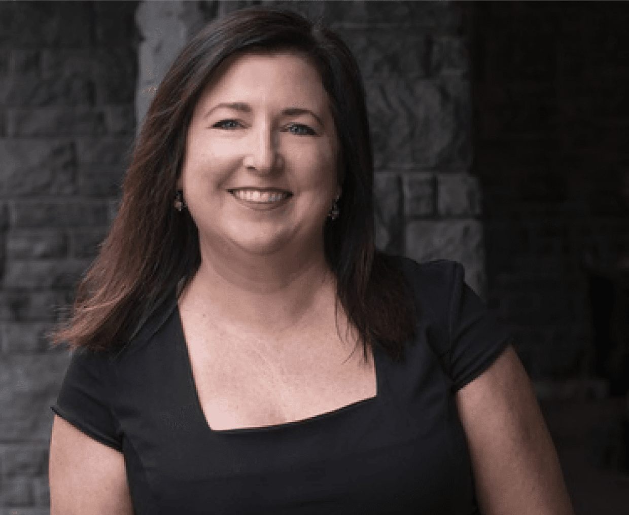 Confident woman with long hair smiling